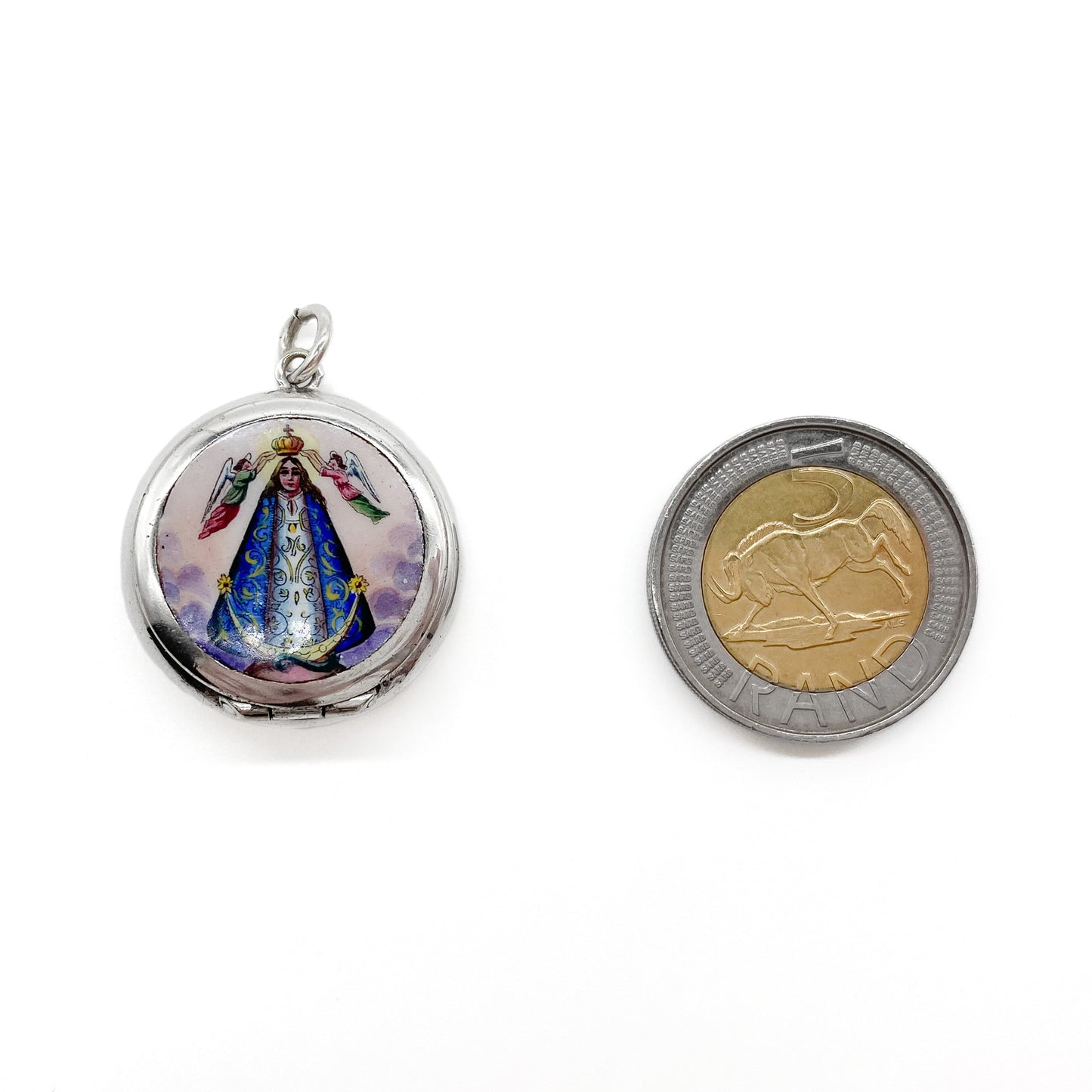 Charming silver enamelled locket depicting Madonna being crowned by two angels.