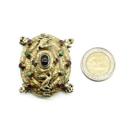 Very unusual Austro-Hungarian tortoise shaped gilt buckle set with garnets and turquoise stones. Adorned with two climbing lizards and beautiful engraving. This piece would look beautiful on a velvet choker.