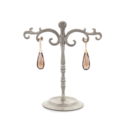 Classic gold-plated silver stud earrings, each set with a beautifully faceted, dangling smokey quartz drop.