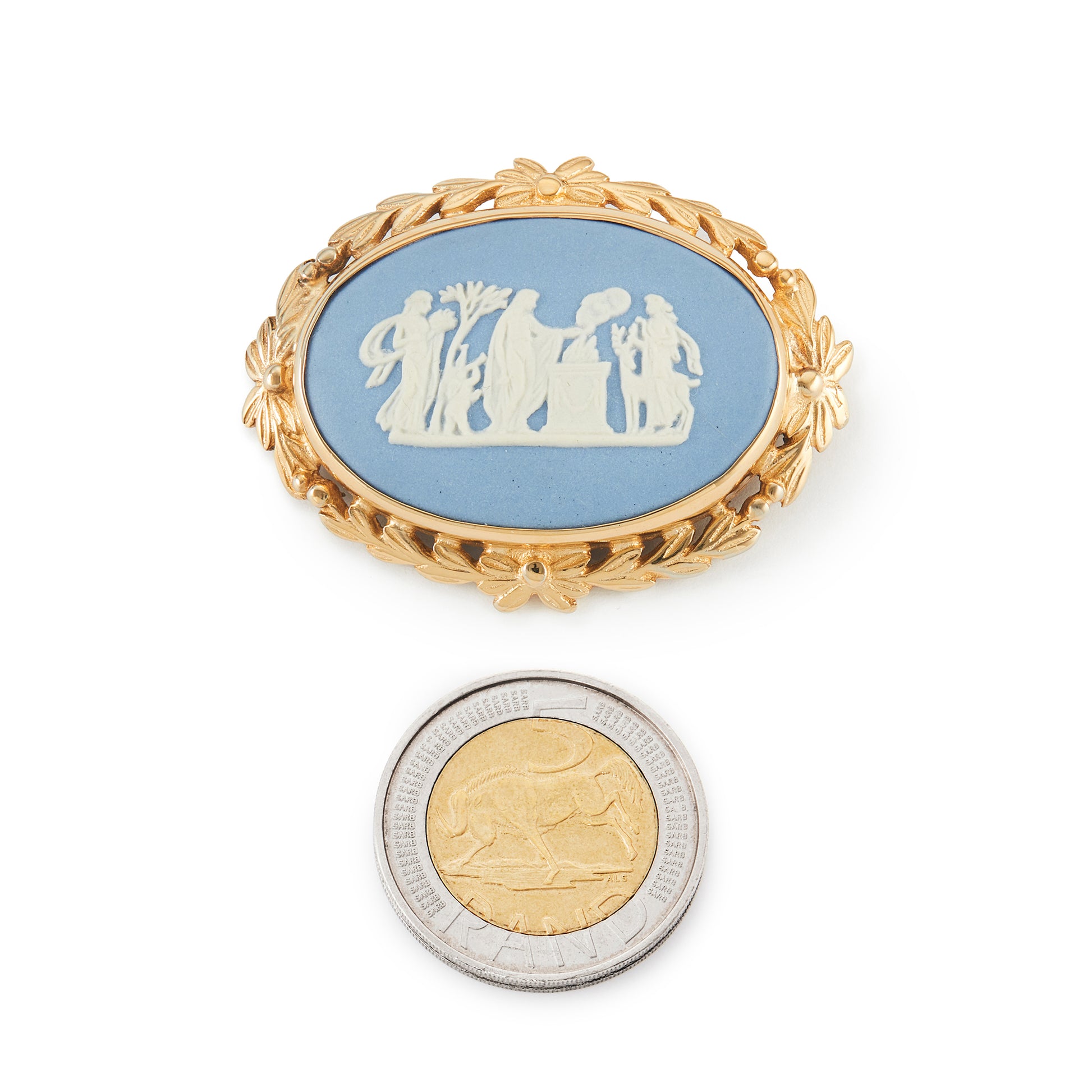 Beautiful blue and white Wedgwood plaque depicting a classic roman scene, in a gold plated brooch setting.