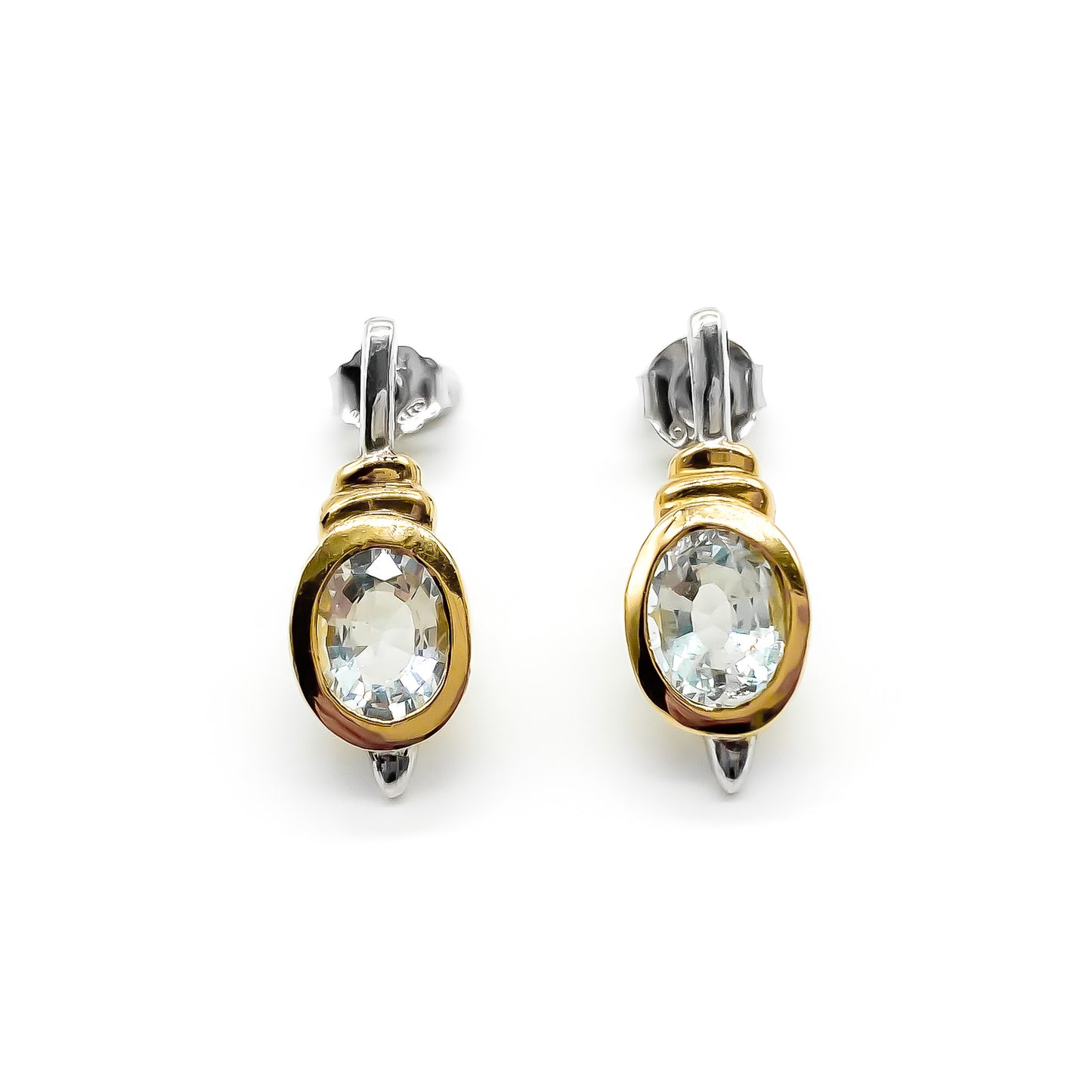 Classic gold on sterling silver drop earrings with tube set oval faceted aquamarine stones.