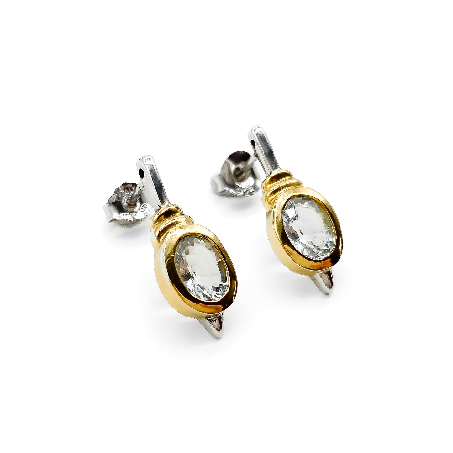 Classic gold on sterling silver drop earrings with tube set oval faceted aquamarine stones.