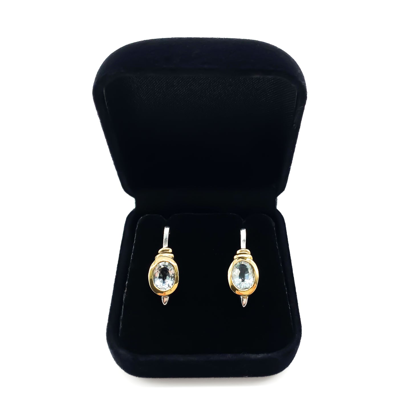 Classic gold on sterling silver drop earrings with tube set oval faceted aquamarine stones.