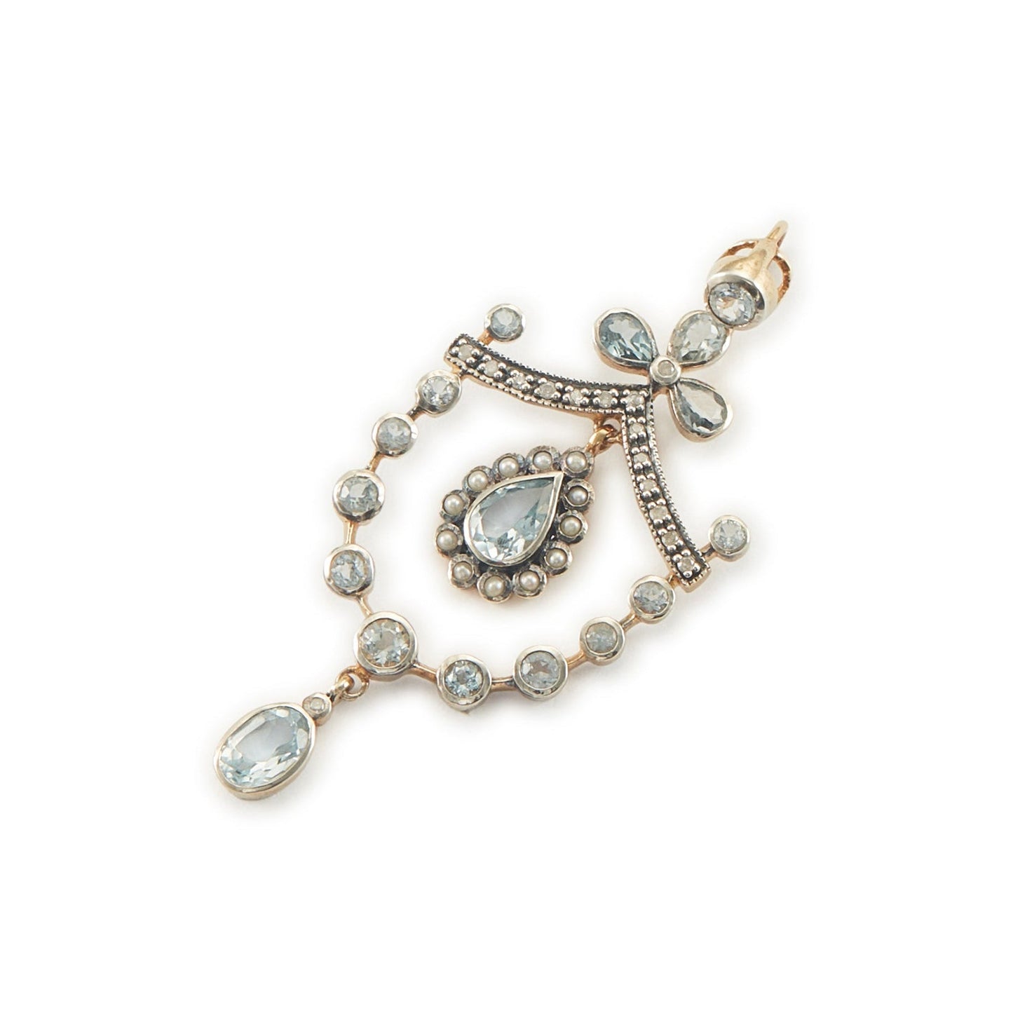 Pretty Edwardian-style gold on silver pendant set with seventeen light blue topaz stones, fifteen small diamonds and twelve tiny seed pearls.