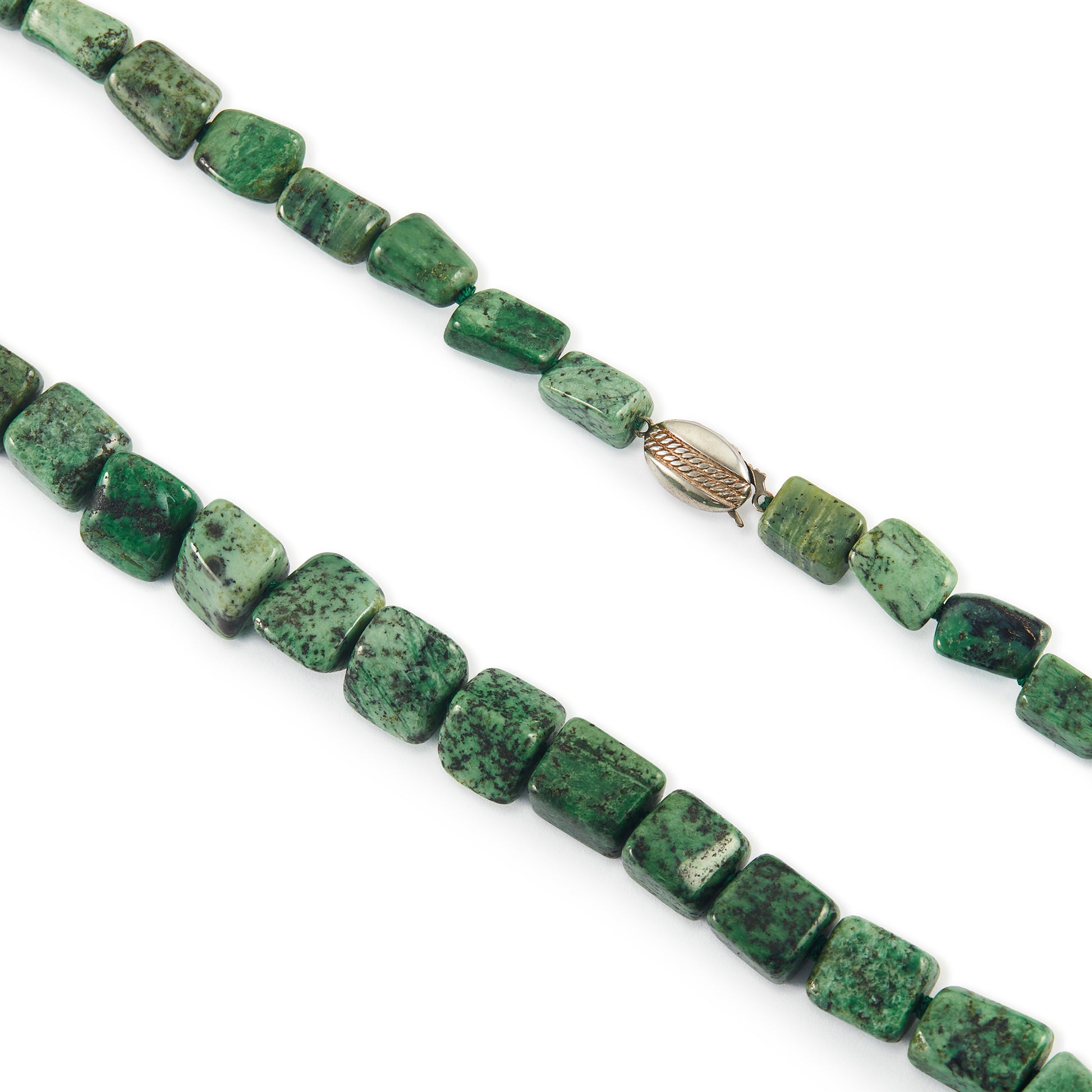 Very unusual, irregular natural hydroglossular vintage string of garnet beads with a variation of beautiful green hues and a sterling silver clasp.