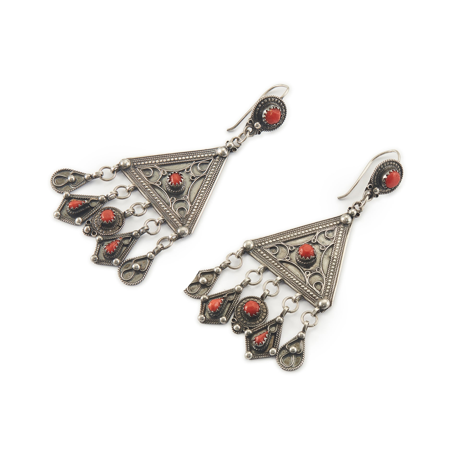 Magnificent ethnic oxidised silver chandelier earrings set with deep red coral cabochons. These large statement earrings are beautifully embossed. 
