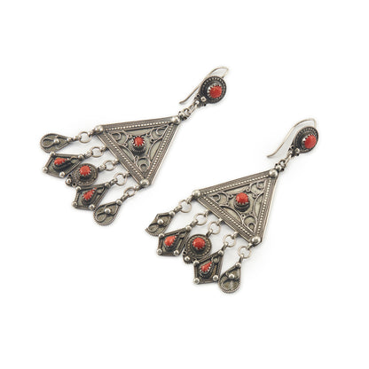 Magnificent ethnic oxidised silver chandelier earrings set with deep red coral cabochons. These large statement earrings are beautifully embossed. 
