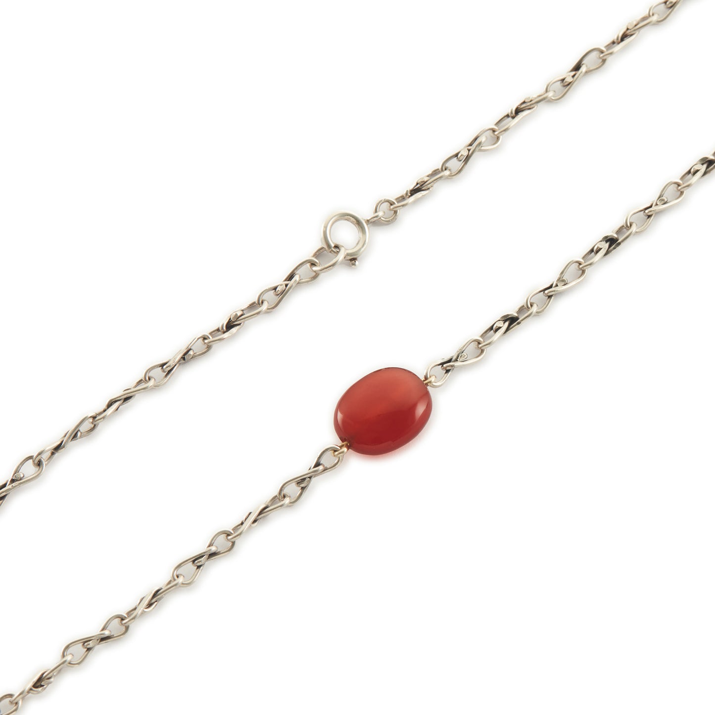 Elegant sterling silver fancy link chain interspersed with seven carnelian stones. Long enough to drape around the neck twice.