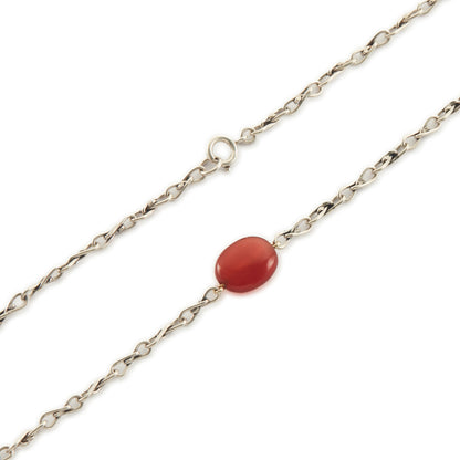 Elegant sterling silver fancy link chain interspersed with seven carnelian stones. Long enough to drape around the neck twice.
