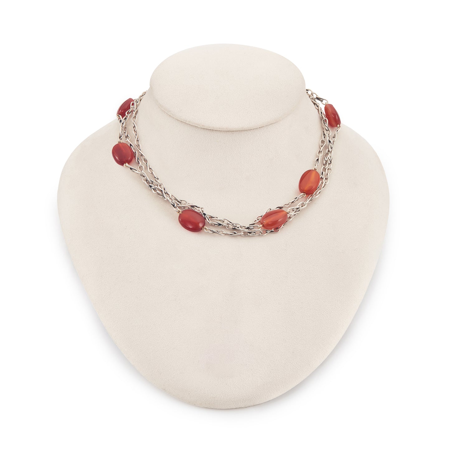 Elegant sterling silver fancy link chain interspersed with seven carnelian stones. Long enough to drape around the neck twice.