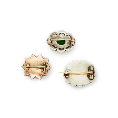 Lot of three quaint silver/gold on silver Victorian miniature brooches set with green and white paste stones, and plaited hair (mourning brooch on bottom right). Lovely to be worn as a group or individually.