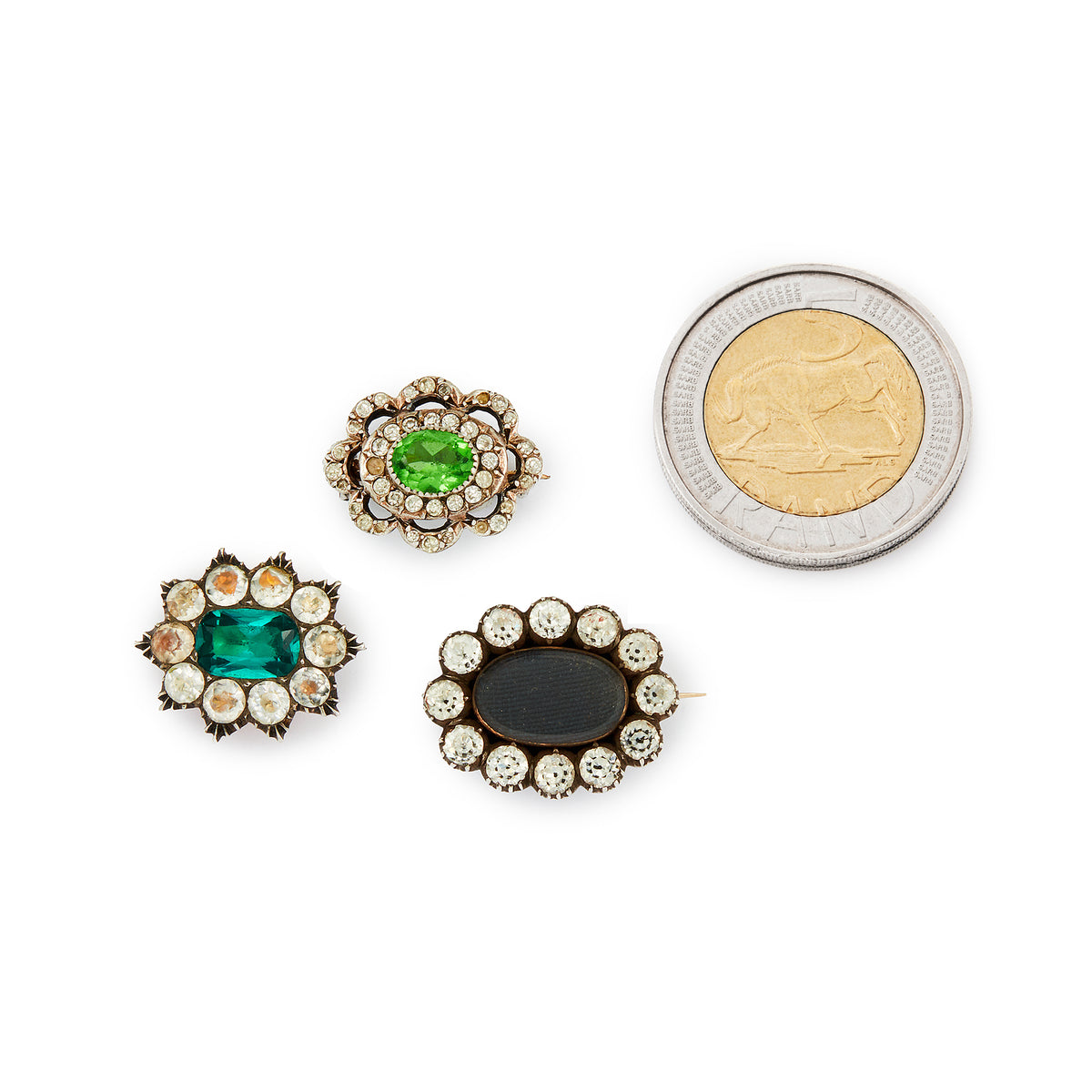 Lot of three quaint silver/gold on silver Victorian miniature brooches set with green and white paste stones, and plaited hair (mourning brooch on bottom right). Lovely to be worn as a group or individually.