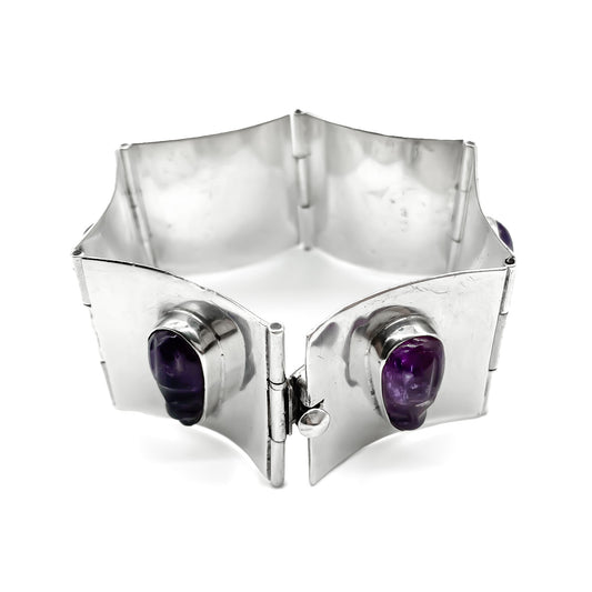 Beautiful sterling silver Mexican panel bracelet set with six carved amethyst faces. Designer Made. Eagle Hallmark (Post 1947)