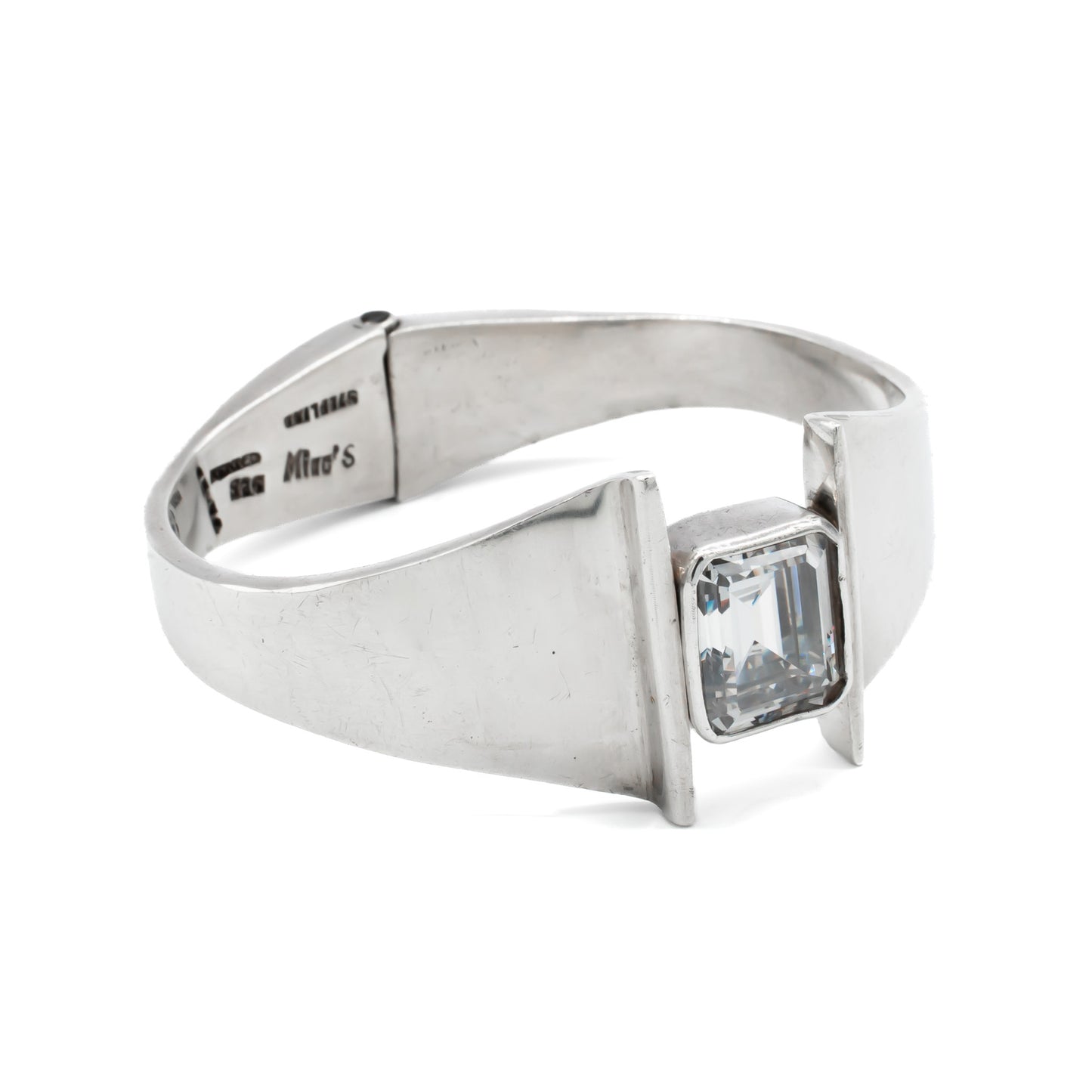 Stunning sterling silver Mexican modernist clamper bangle set with a rectangular rock crystal. Signed Mino’s. Post 1979 