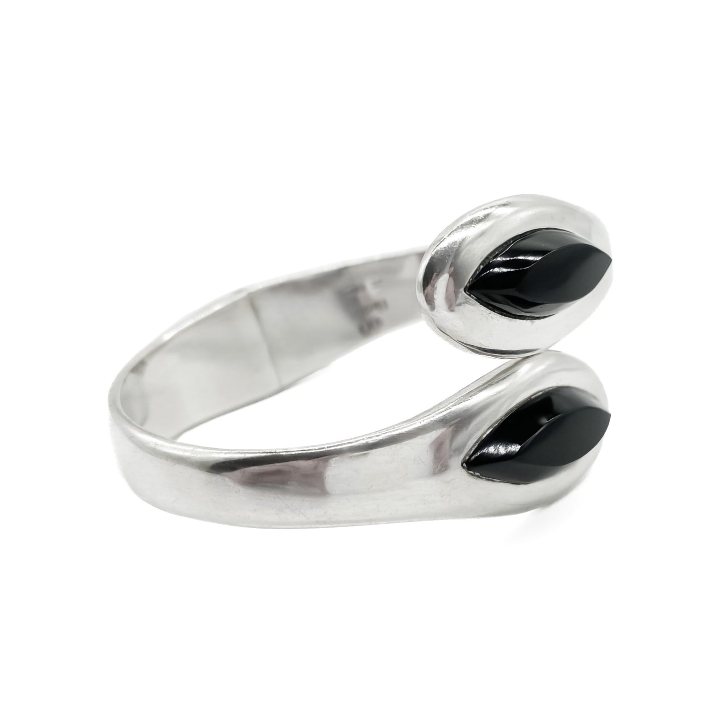 Classic sterling silver Mexican clamper bangle with two faceted onyx stones.