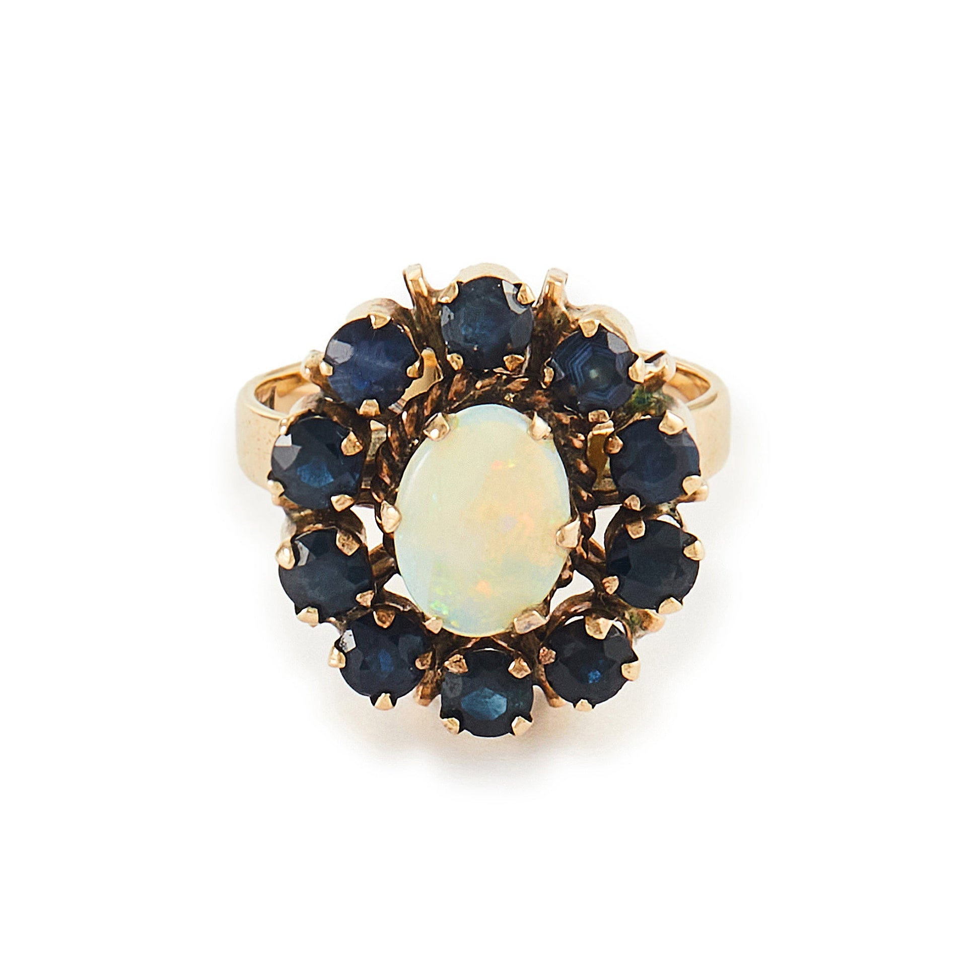 Gorgeous Mid-Century 14ct gold ring set with an oval cabochon opal in the centre, surrounded by ten deep blue sapphires. 
