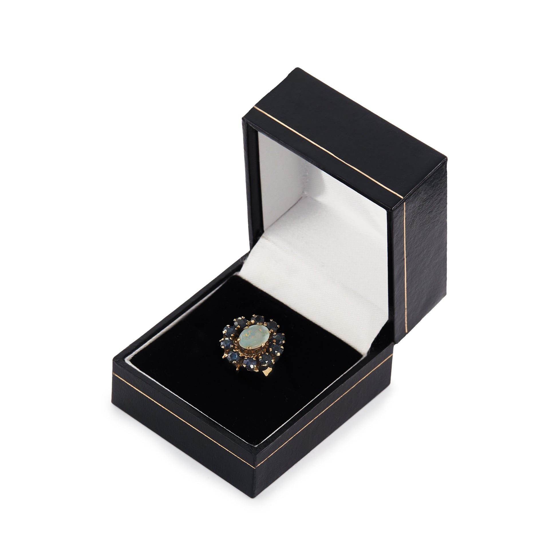 Gorgeous Mid-Century 14ct gold ring set with an oval cabochon opal in the centre, surrounded by ten deep blue sapphires. 