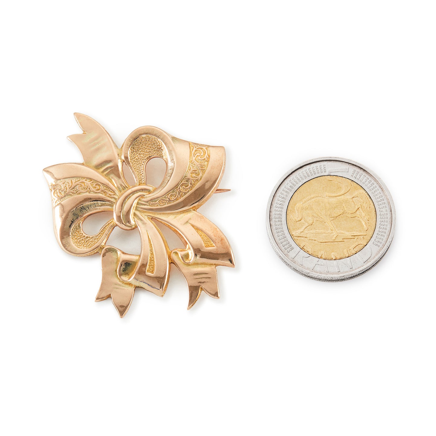 Sought after 9ct gold Candida mid-century bow brooch with a maker’s mark.