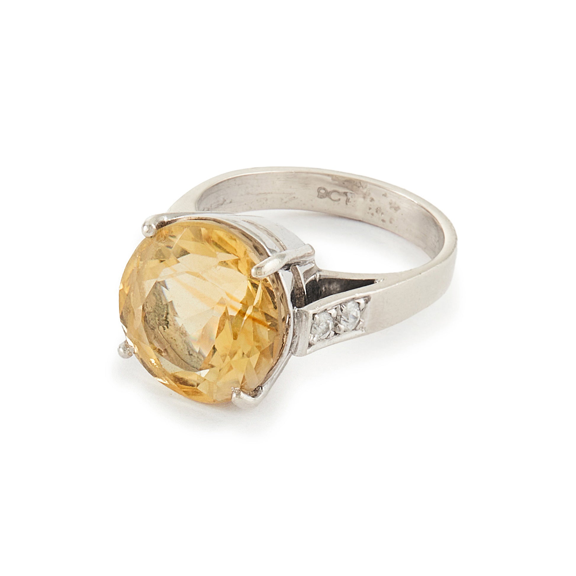 Classic Mid-Century 9ct white gold ring set with a beautifully faceted champagne-coloured citrine stone, and two white spinels on each shoulder.