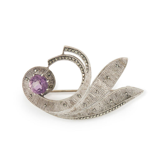 Stylish mid-century sterling silver Theodor Fahner brooch set with a vibrant, faceted amethyst and marcasites. Germany