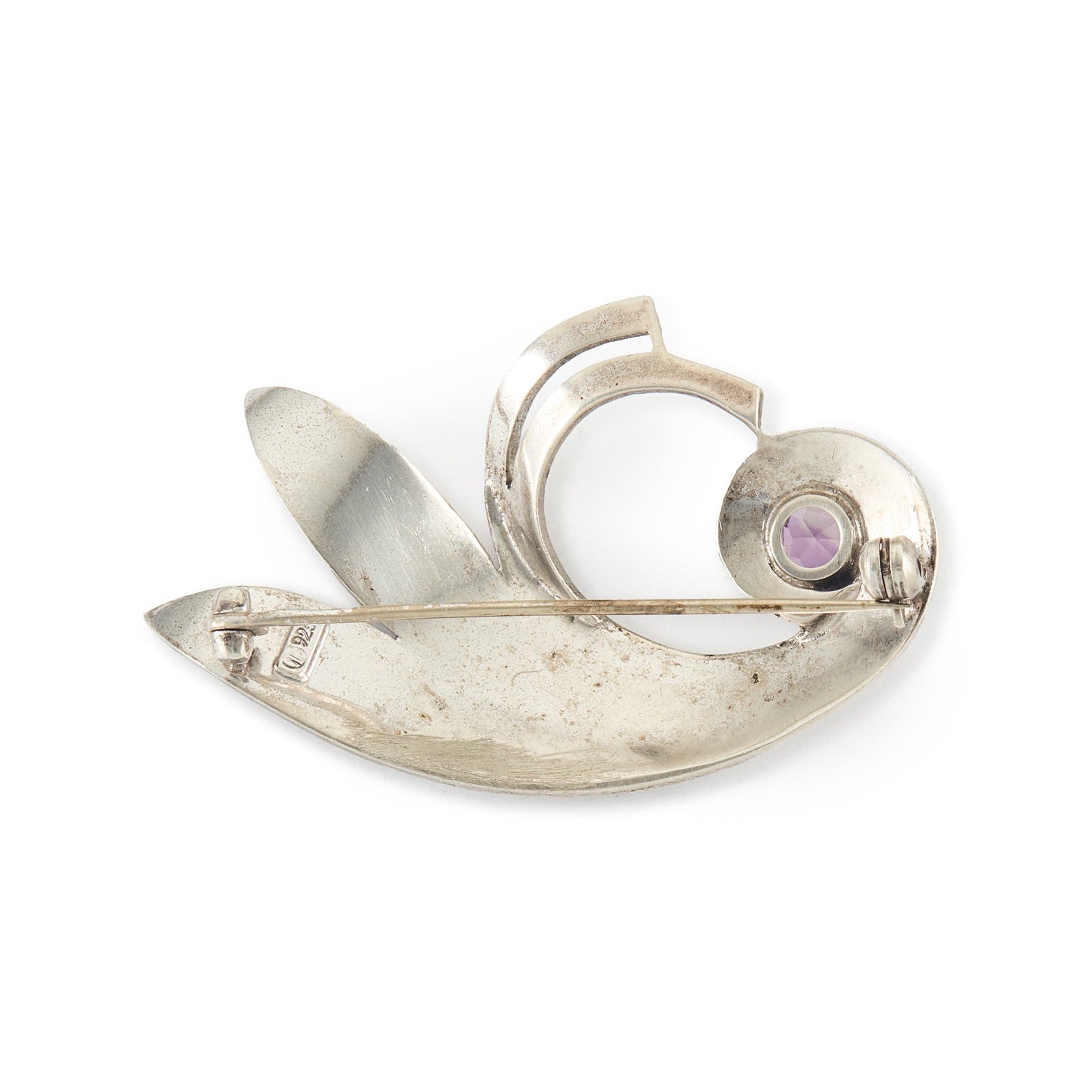 Stylish mid-century sterling silver Theodor Fahner brooch set with a vibrant, faceted amethyst and marcasites. Germany