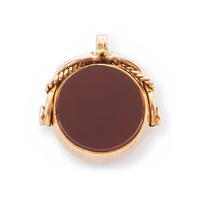 Miniature Victorian 9ct rose gold swivel fob set with a carnelian disc on one side and a bloodstone disc on the other side.
