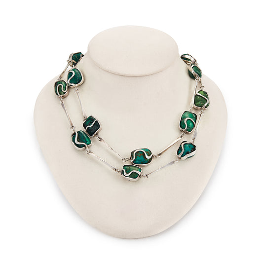 Magnificent Modernist handmade silver necklace set with fifteen irregular-shape, natural turquoise pieces in varying shades of turquoise and green.