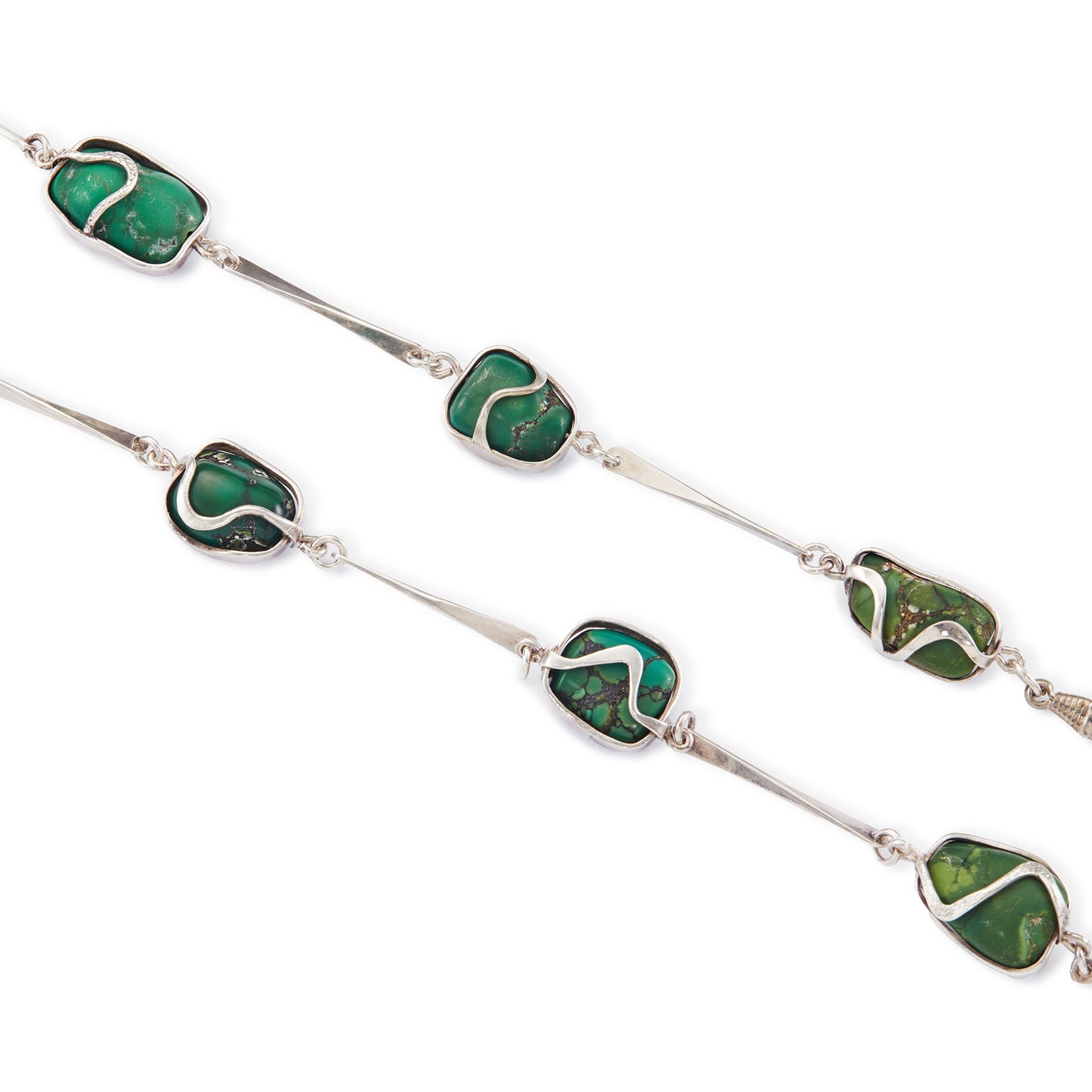 Magnificent Modernist handmade silver necklace set with fifteen irregular-shape, natural turquoise pieces in varying shades of turquoise and green.