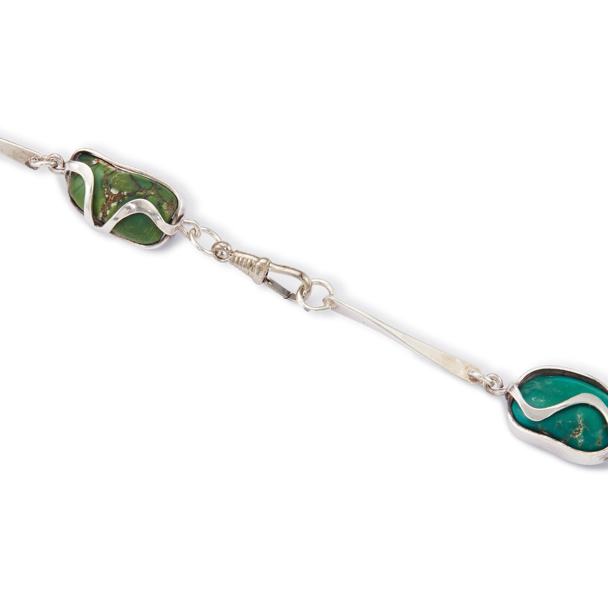 Magnificent Modernist handmade silver necklace set with fifteen irregular-shape, natural turquoise pieces in varying shades of turquoise and green.