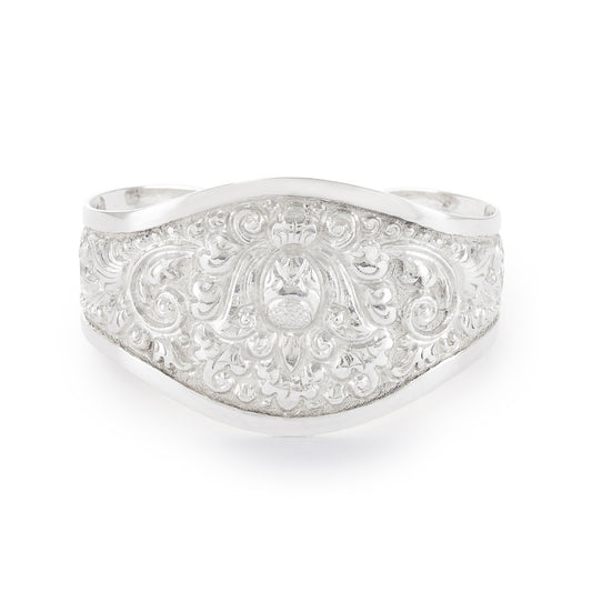 Gorgeous silver repoussé bangle with ornate detail. The bangle is open so the size is adjustable. Circa 1930s