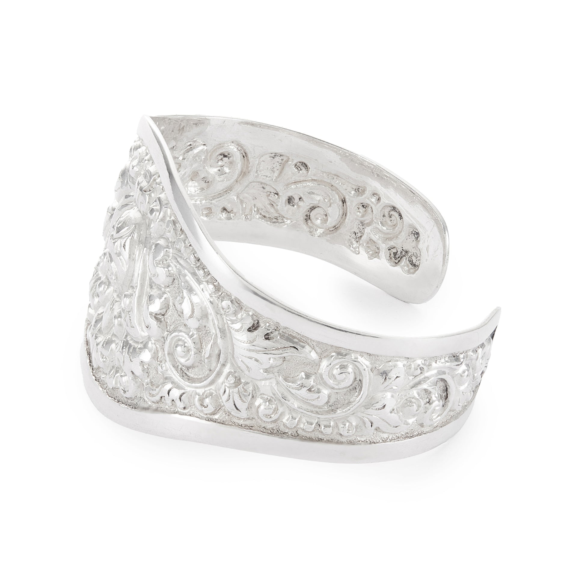 Gorgeous silver repoussé bangle with ornate detail. The bangle is open so the size is adjustable. Circa 1930s
