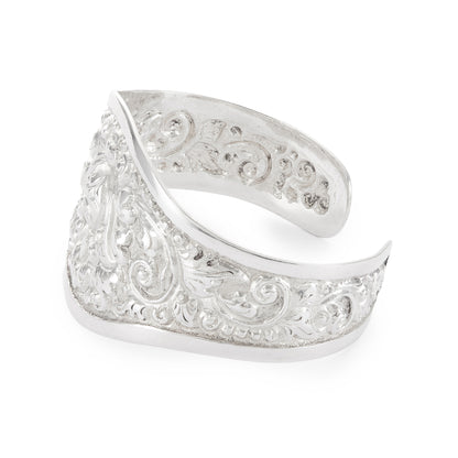 Gorgeous silver repoussé bangle with ornate detail. The bangle is open so the size is adjustable. Circa 1930s