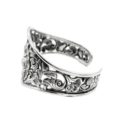 Gorgeous silver repoussé bangle with ornate detail. Open so size is adjustable. Circa 1930s