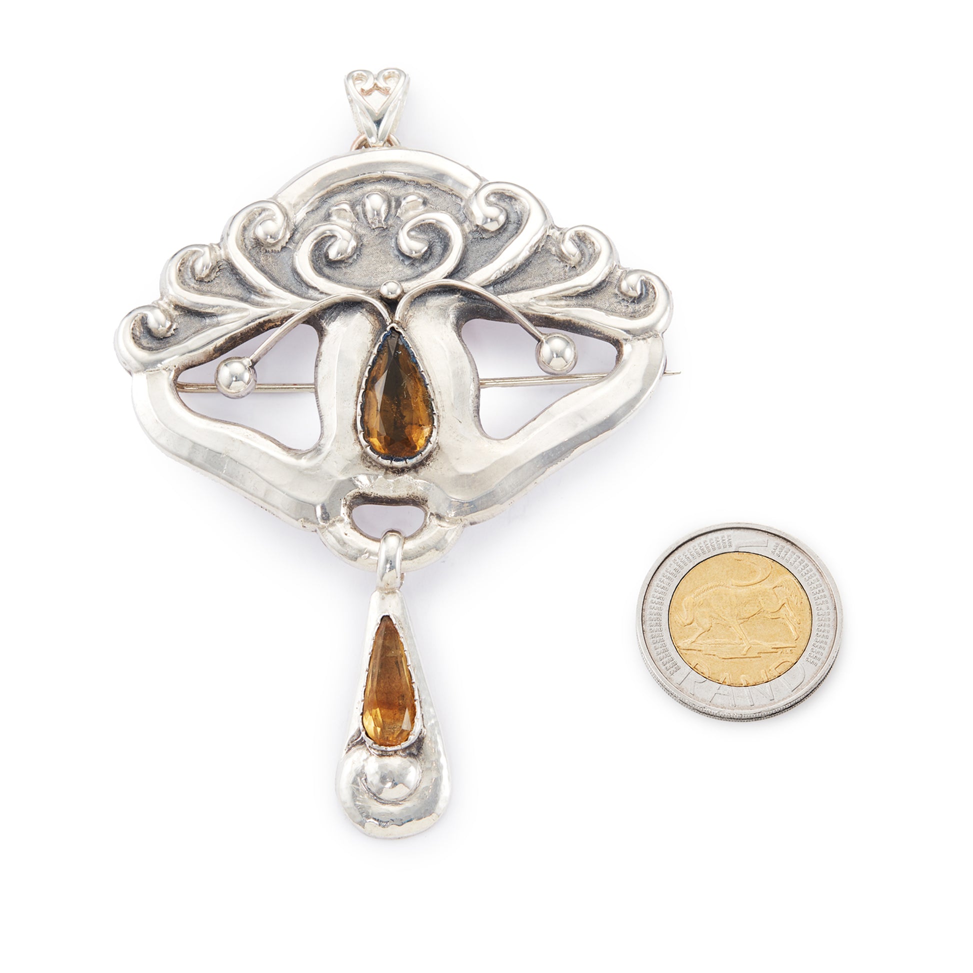 Gorgeous large Art Nouveau repoussé silver and citrine Scandinavian pendant which can also be worn as a brooch. Pin and pendant attachments have been replaced.