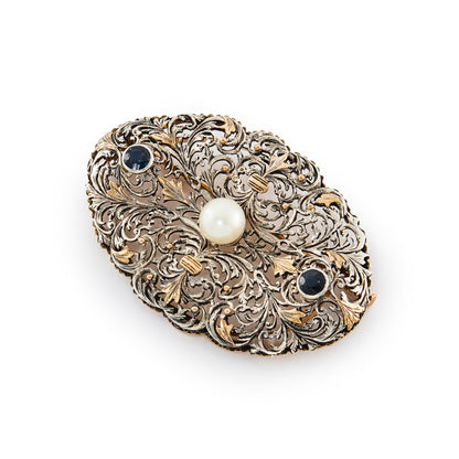 Impressive Edwardian filigree rose gold and silver brooch set with two deep blue faceted sapphires and one large cultured pearl.