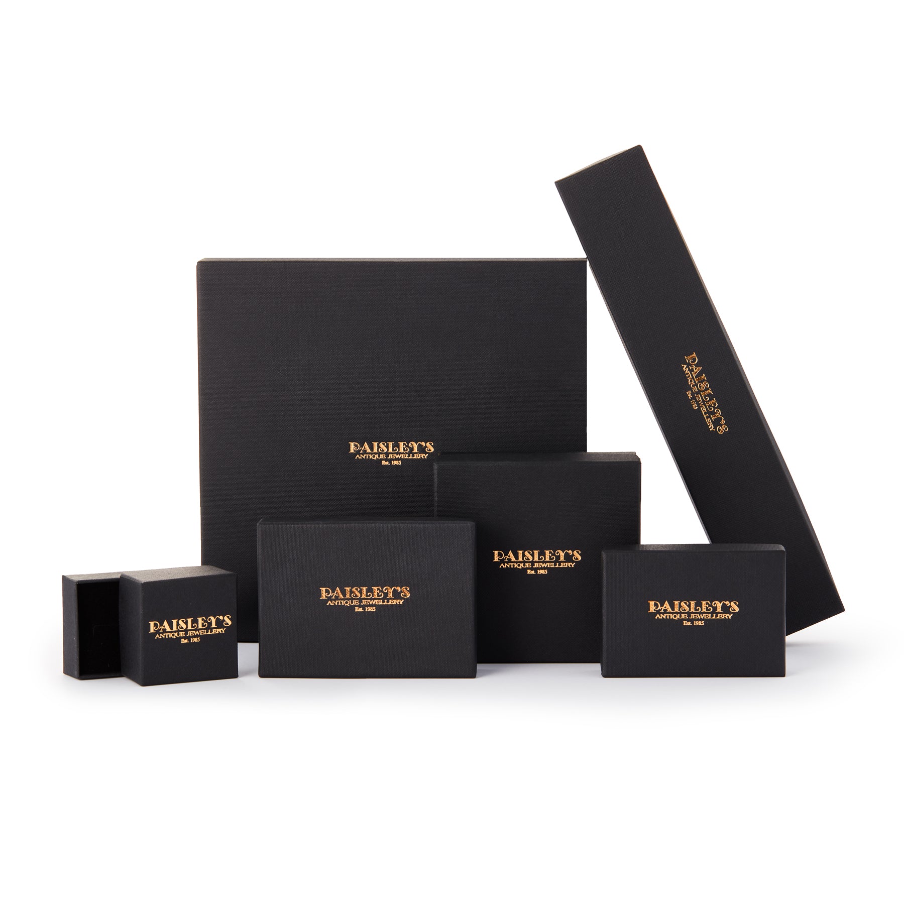 Set of black jewellery boxes with gold logo on a white background