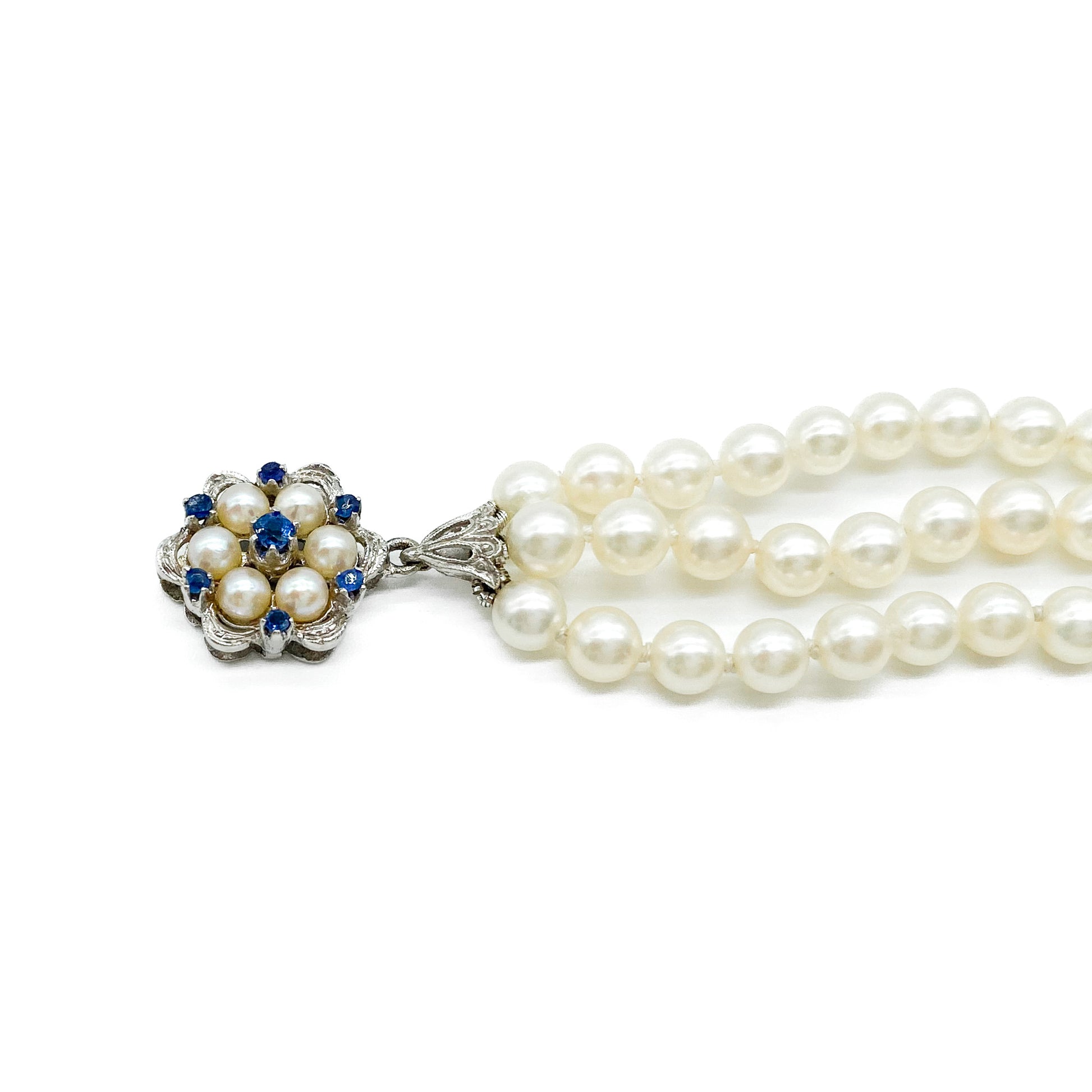 Pretty vintage three strand cultured pearl bracelet with an exquisite 18ct white gold sapphire and pearl clasp.