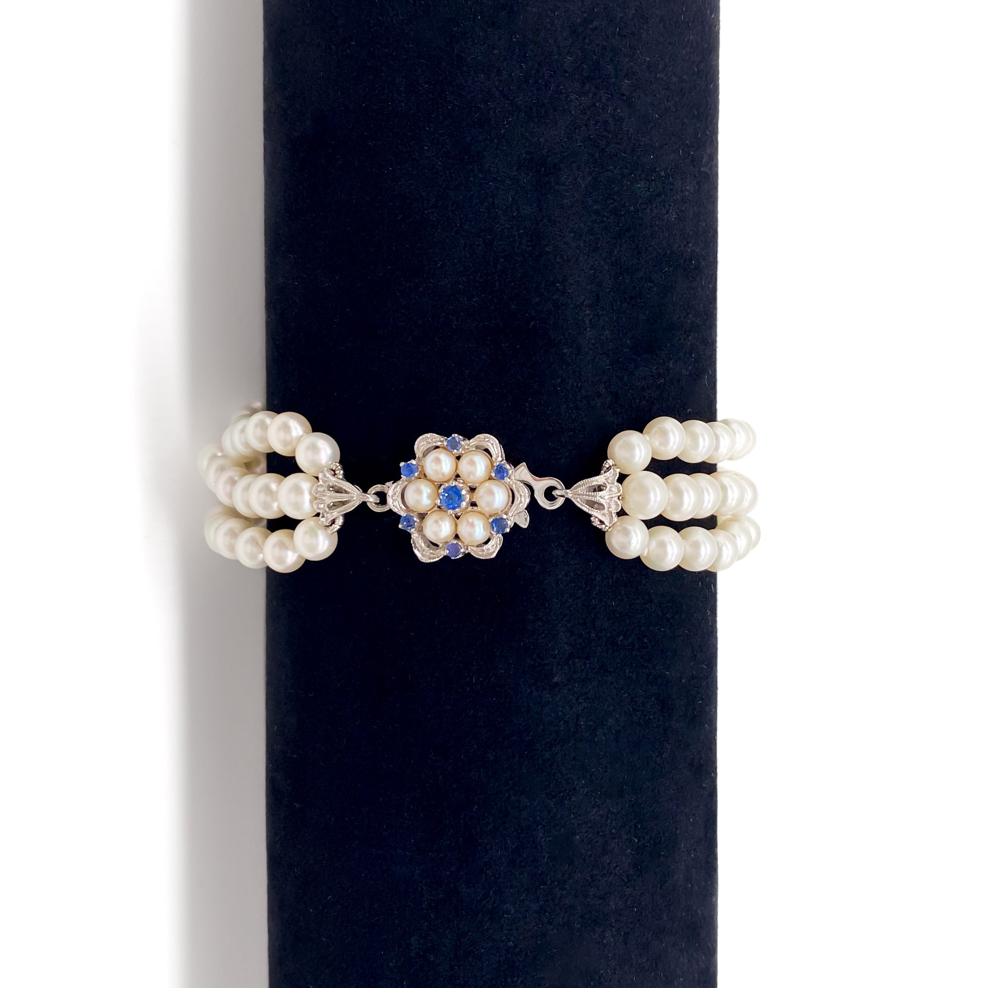 Pretty vintage three strand cultured pearl bracelet with an exquisite 18ct white gold sapphire and pearl clasp.