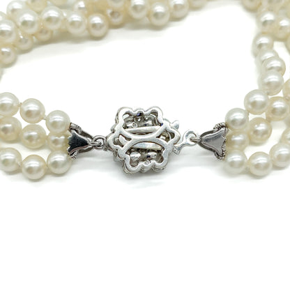 Pretty vintage three strand cultured pearl bracelet with an exquisite 18ct white gold sapphire and pearl clasp.