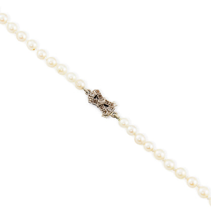 Lustrous string of graduated cultured saltwater pearls with an 18ct white gold Art Deco clasp set with old and mine cut diamonds.