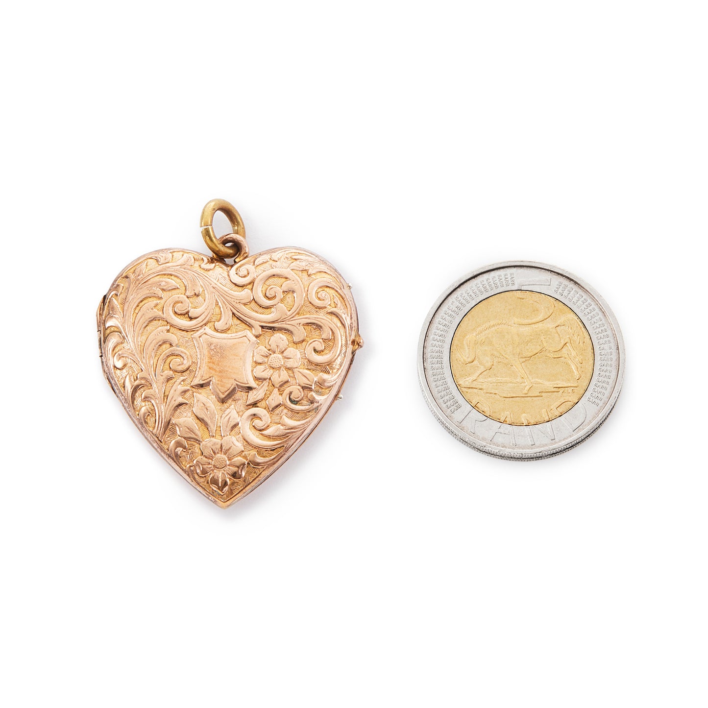 Pretty rose gold plated double-sided Victorian locket with embossing on the front. The locket opens and can hold photographs.