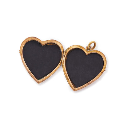 Pretty rose gold plated double-sided Victorian locket with embossing on the front. The locket opens and can hold photographs.