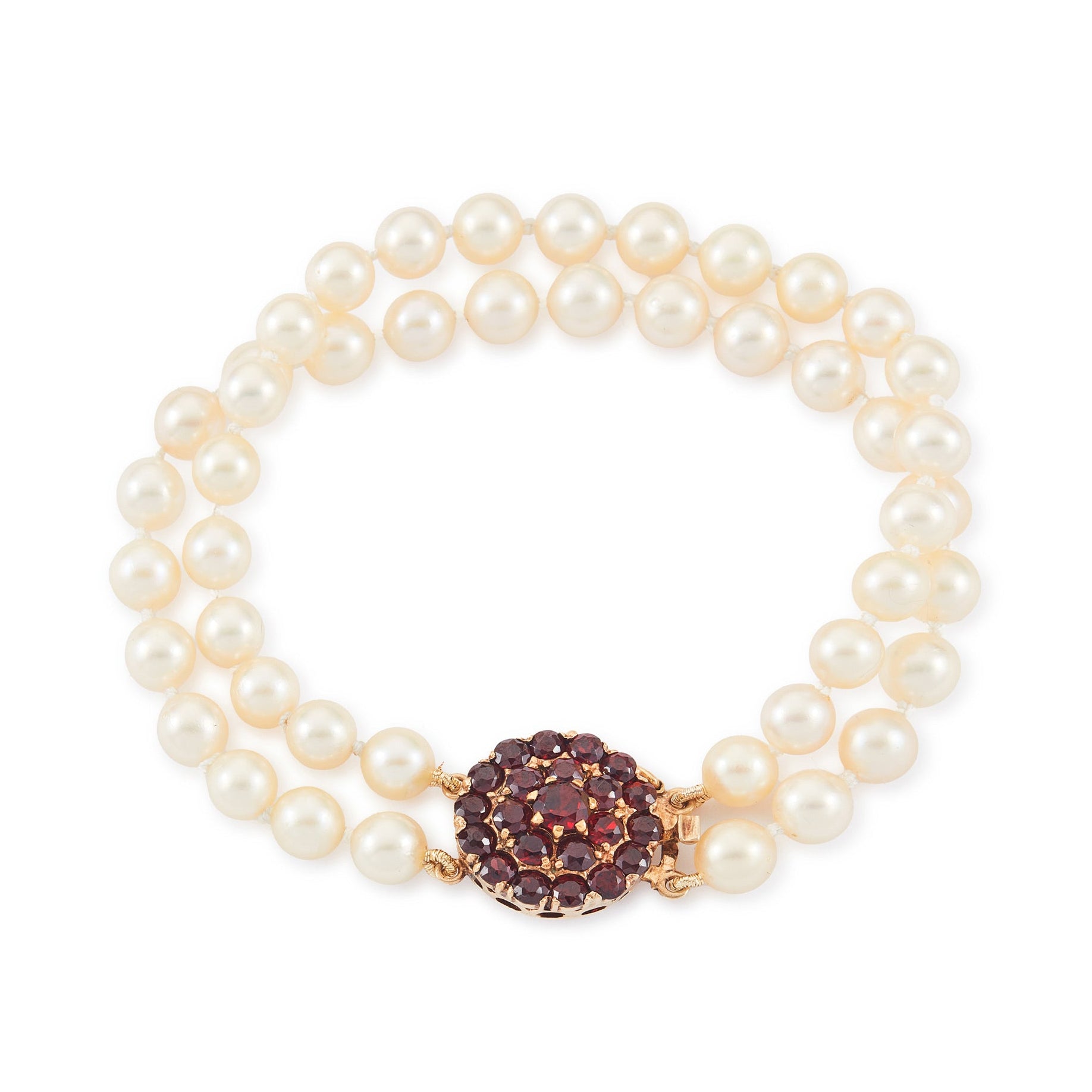 Exquisite double-strand seawater pearl bracelet with a stunning 9ct gold clasp set with twenty-two deep red garnets.