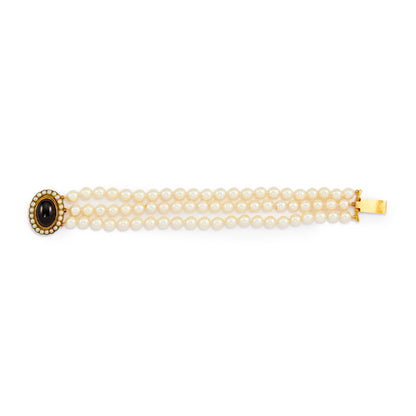 Glamorous three strand cultured seawater pearl bracelet with a spectacular Victorian 9ct gold cabochon garnet and seed pearl clasp.
