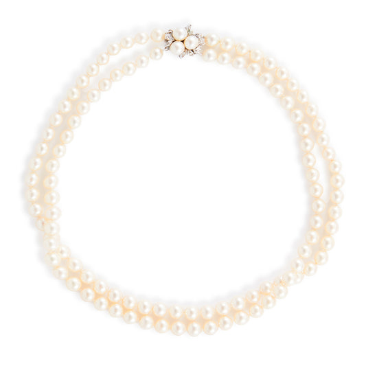 Exquisite double strand of lustrous cultured seawater pearls with a stunning 14ct white gold clasp set with nine small diamonds and three pearls. Can be worn as a choker or wrapped around the wrist as a four-strand bracelet.
