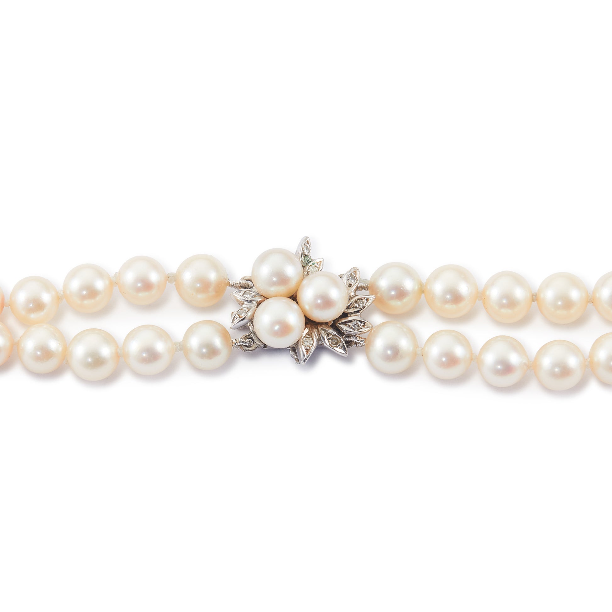 Exquisite double strand of lustrous cultured seawater pearls with a stunning 14ct white gold clasp set with nine small diamonds and three pearls. Can be worn as a choker or wrapped around the wrist as a four-strand bracelet.