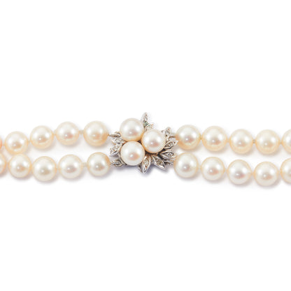 Exquisite double strand of lustrous cultured seawater pearls with a stunning 14ct white gold clasp set with nine small diamonds and three pearls. Can be worn as a choker or wrapped around the wrist as a four-strand bracelet.