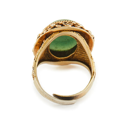 Beautiful green quartzite cabochon gemstone in an intricate filigree silver-gilt setting. Adjustable shank.
