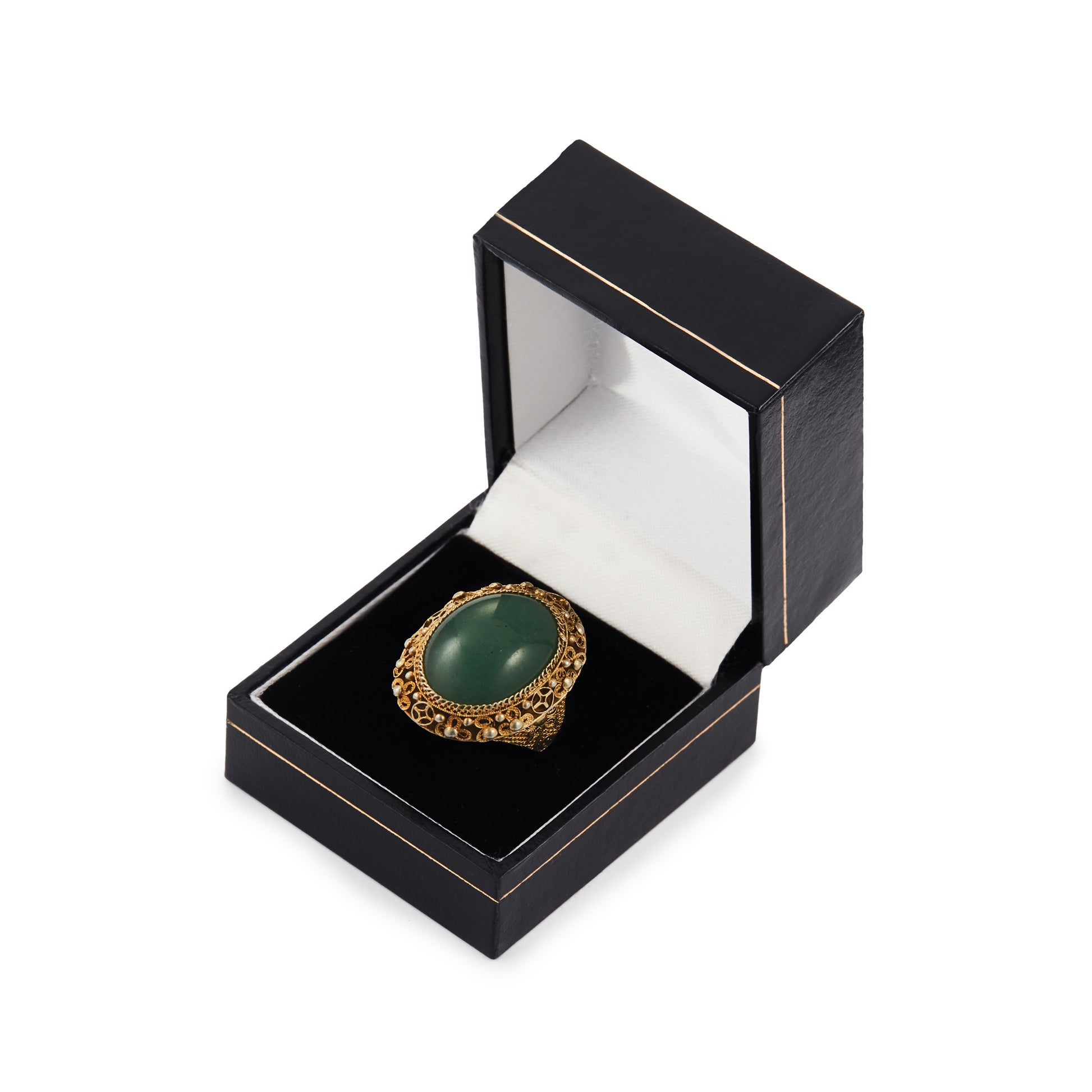 Beautiful green quartzite cabochon gemstone in an intricate filigree silver-gilt setting. Adjustable shank.