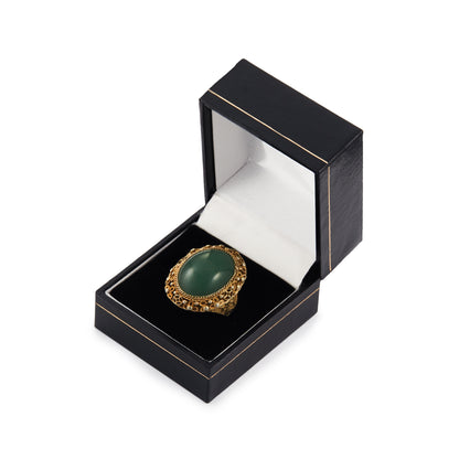 Beautiful green quartzite cabochon gemstone in an intricate filigree silver-gilt setting. Adjustable shank.